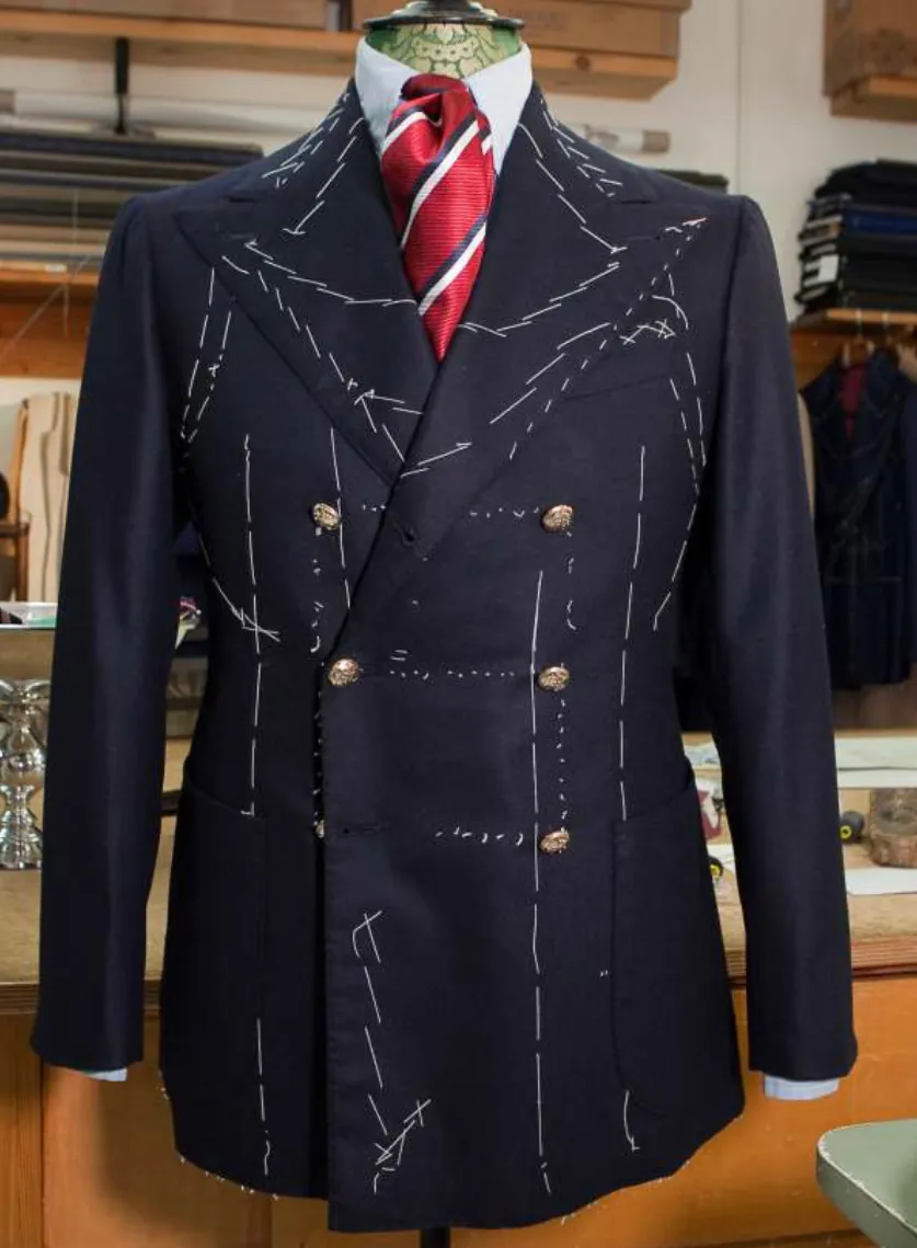 Navy double-breasted jacket with tailor's chalk marks