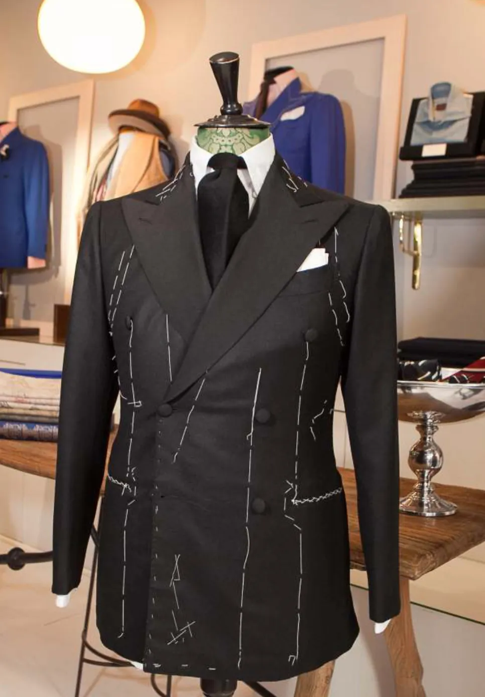 Black double-breasted jacket during basting