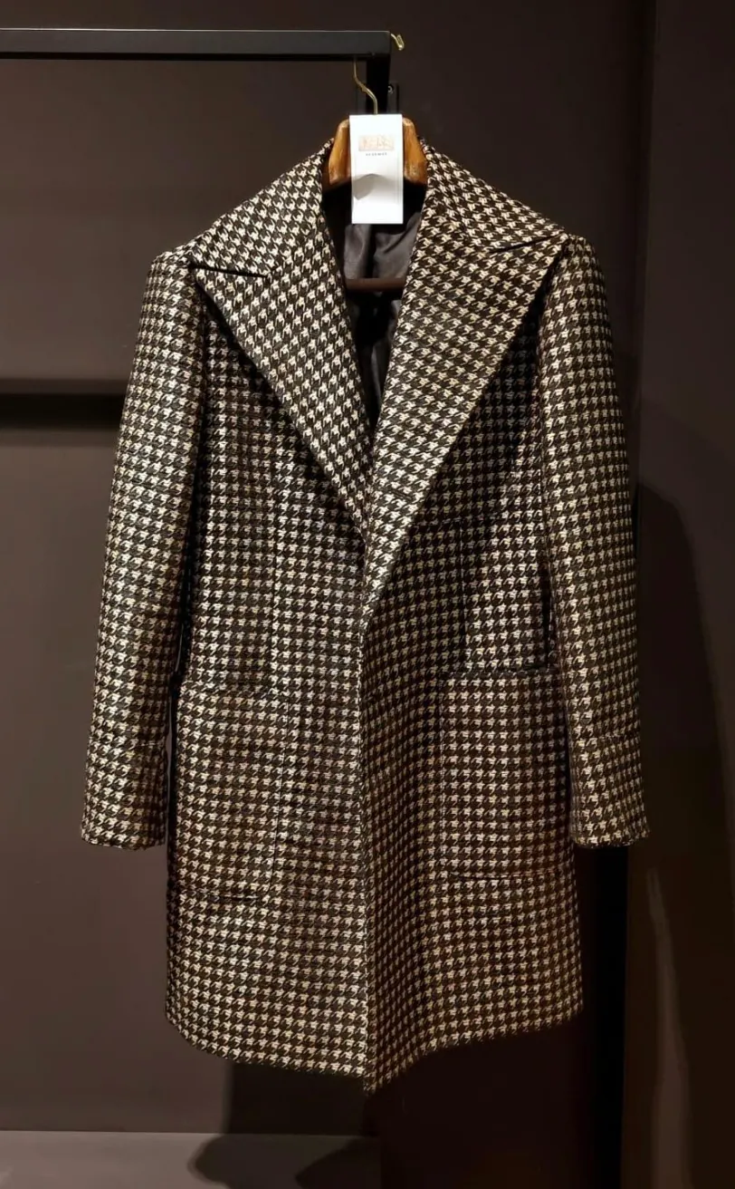 Houndstooth Vibe overcoat on a hanger