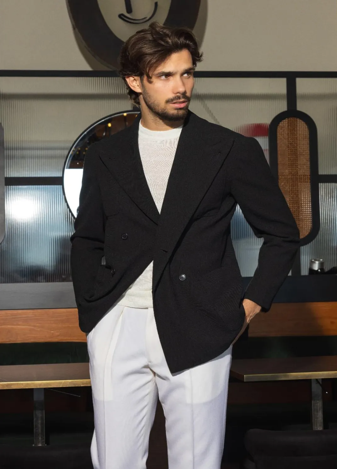 Black double-breasted jacket with white trousers